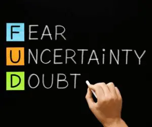 Akróni FUD: strah, nesigurnost i sumnja prikazani kroz boje na crnoj pozadini.