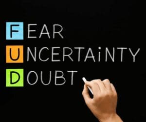 Akróni FUD: strah, nesigurnost i sumnja prikazani kroz boje na crnoj pozadini.