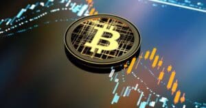 Bitcoin novčić s grafikonima trgovanja, simbolizirajući volatilnost kriptovaluta i investicijske prilike.