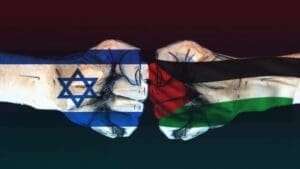 Sukob između Izraela i Palestine prikazan kroz stisnute šake sa simbolima zastava.