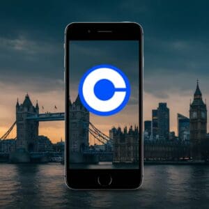 Pametni telefon ispred londonskih znamenitosti: Tower Bridge, Big Ben, Parlament, tehnologija, povijest.